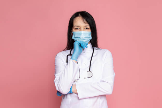 young-woman-white-medical-suit-blue-gloves-blue-protective-mask-with-stethoscope-pink_140725-14814
